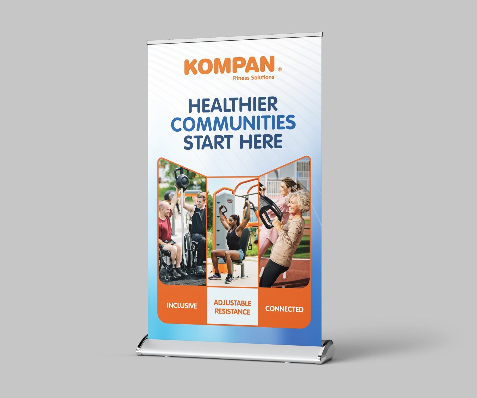 Roll-up banner for KOMPAN Fitness Solutions headed Healthier communities start here, with photos of people using outdoor fitness equipment and three orange feature tags