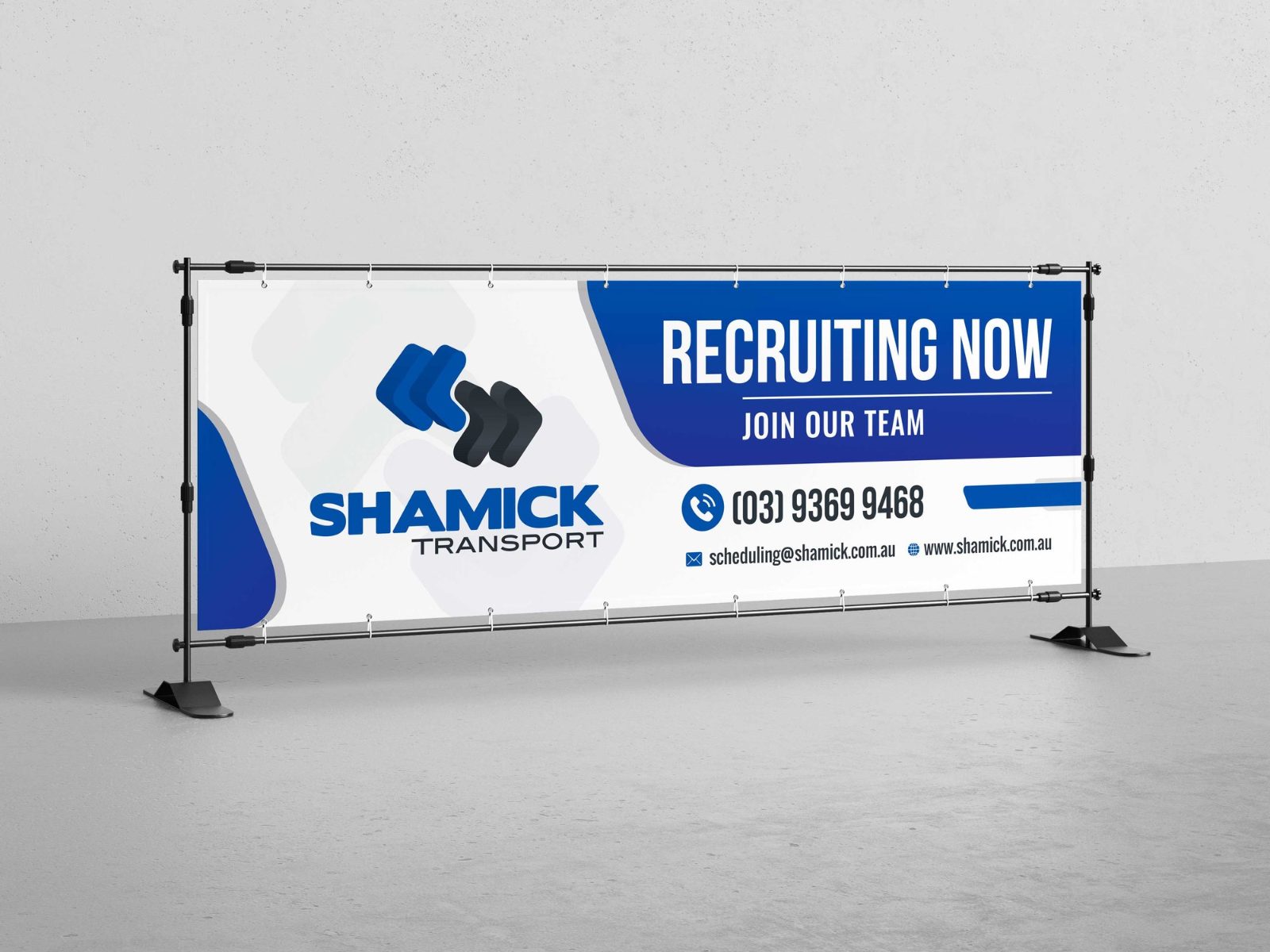 Wide blue and white banner for Shamick Transport on a stand, headed Recruiting now, Join our team, with a phone number and web address